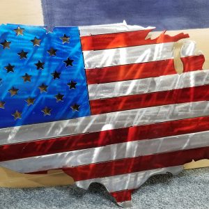 A wooden map of the U.S. painted like a worn American flag with missing pieces.