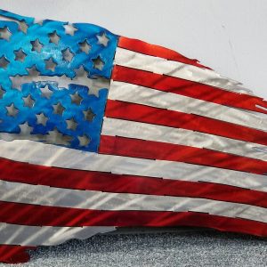 Tattered American flag with worn stars and stripes.
