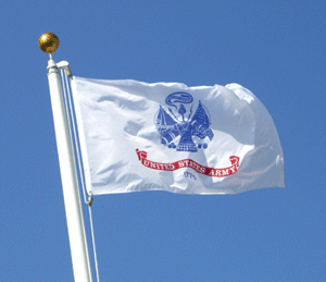 White flag with a blue emblem and red text waving on a pole.