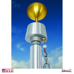 A large golden trophy atop a silver pole against a blue sky.