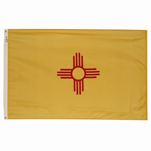 The flag of New Mexico with a red Zia sun symbol on a yellow field.