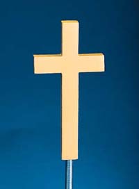 A simple wooden cross against a blue background.