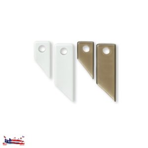 Two white and two bronze metal shelf brackets with keyhole slots.