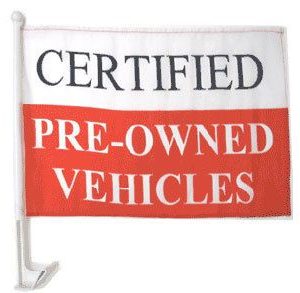Flag advertising certified pre-owned vehicles at a dealership.