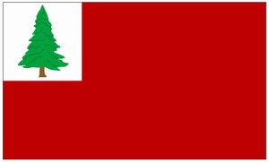 A red flag with a white canton featuring a green cedar tree.