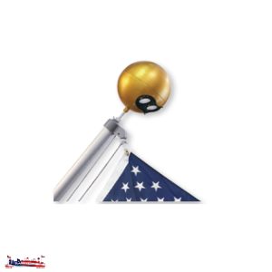 A folded American flag with a ceremonial flagpole and golden finial.
