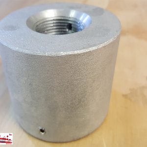A threaded metal cylindrical component on a wooden surface.