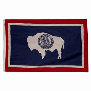 Flag featuring a white buffalo silhouette on a blue field with red and white borders.